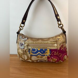 Coach 2010 EUC POPPY Tan and Purple
Shoulder Bag with glitter strap